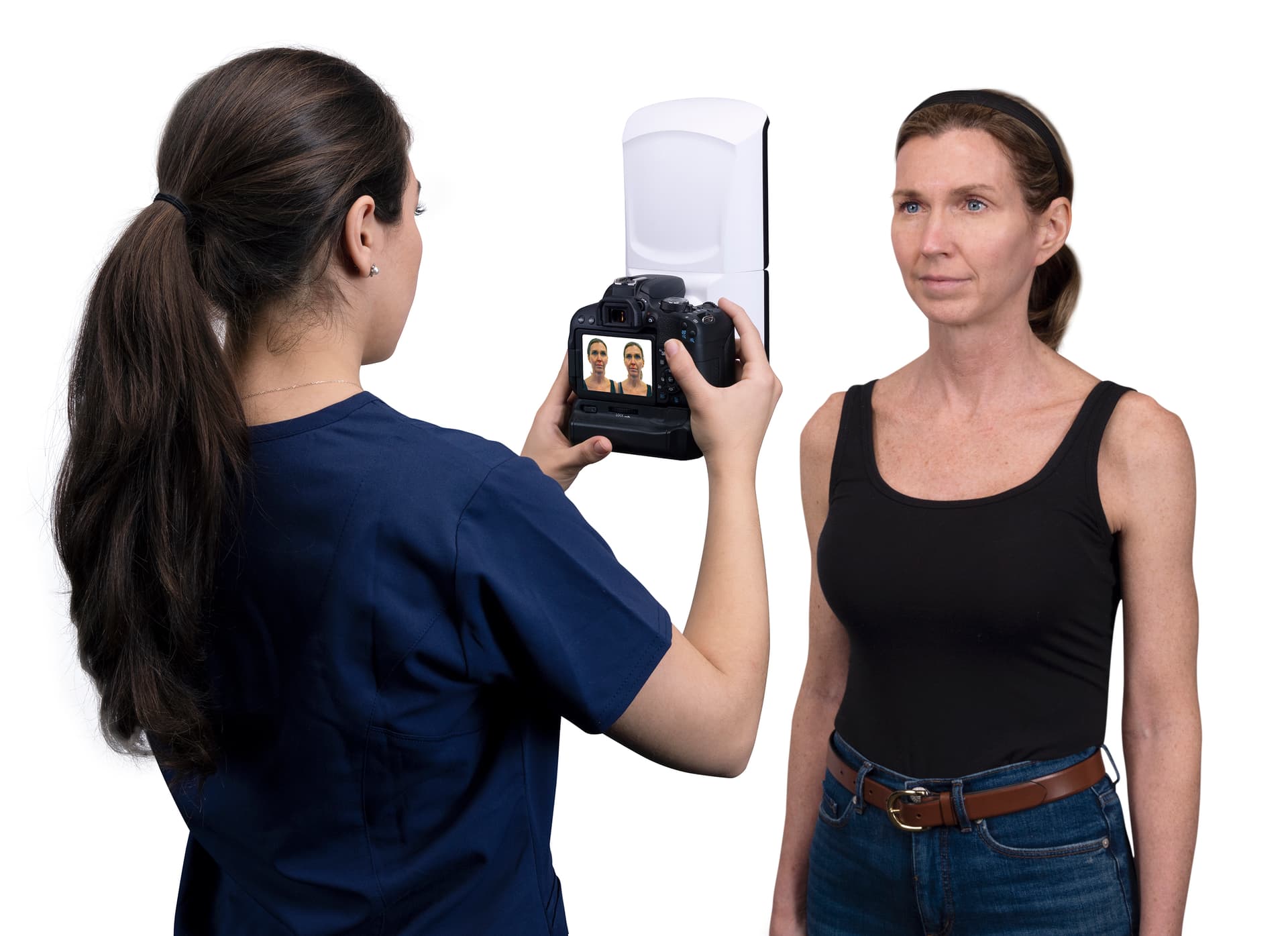 Clinician photographing a patient using the Vectra H2 3D imaging system for standardised rhinoplasty documentation